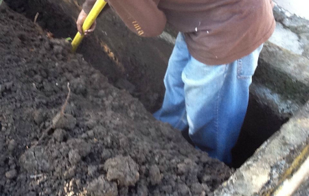 Trenching for French Drain Installation