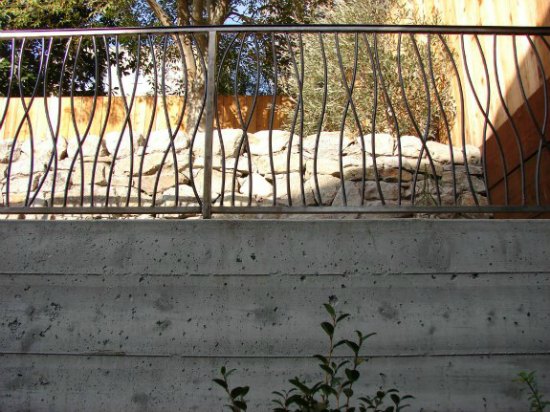 Custom Iron Handrailing on Concrete Retaining Wall 