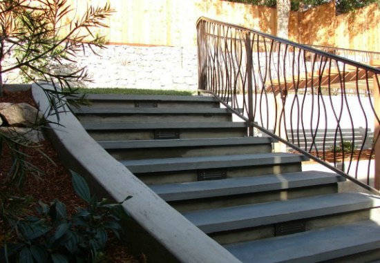 Lighted Stone Stairs and Custom Iron Handrail 